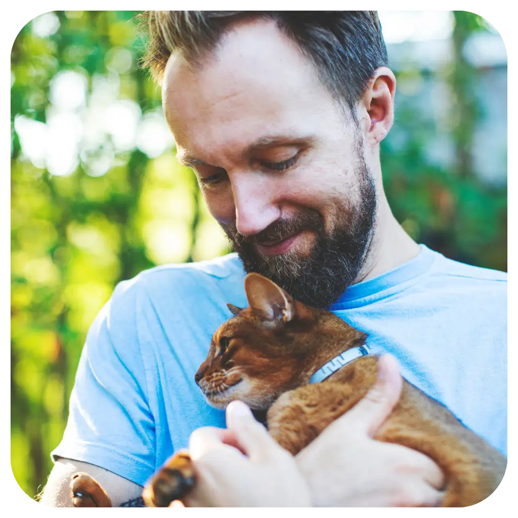 A man hugging his Emotional Support Animal in a store after registering with ESA registry UK