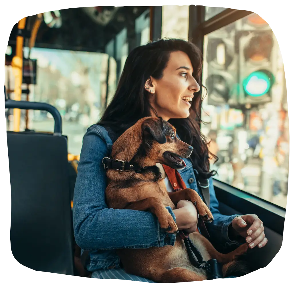 A women very happy with her emotional support animal on the bus after registering with ESA Registry UK