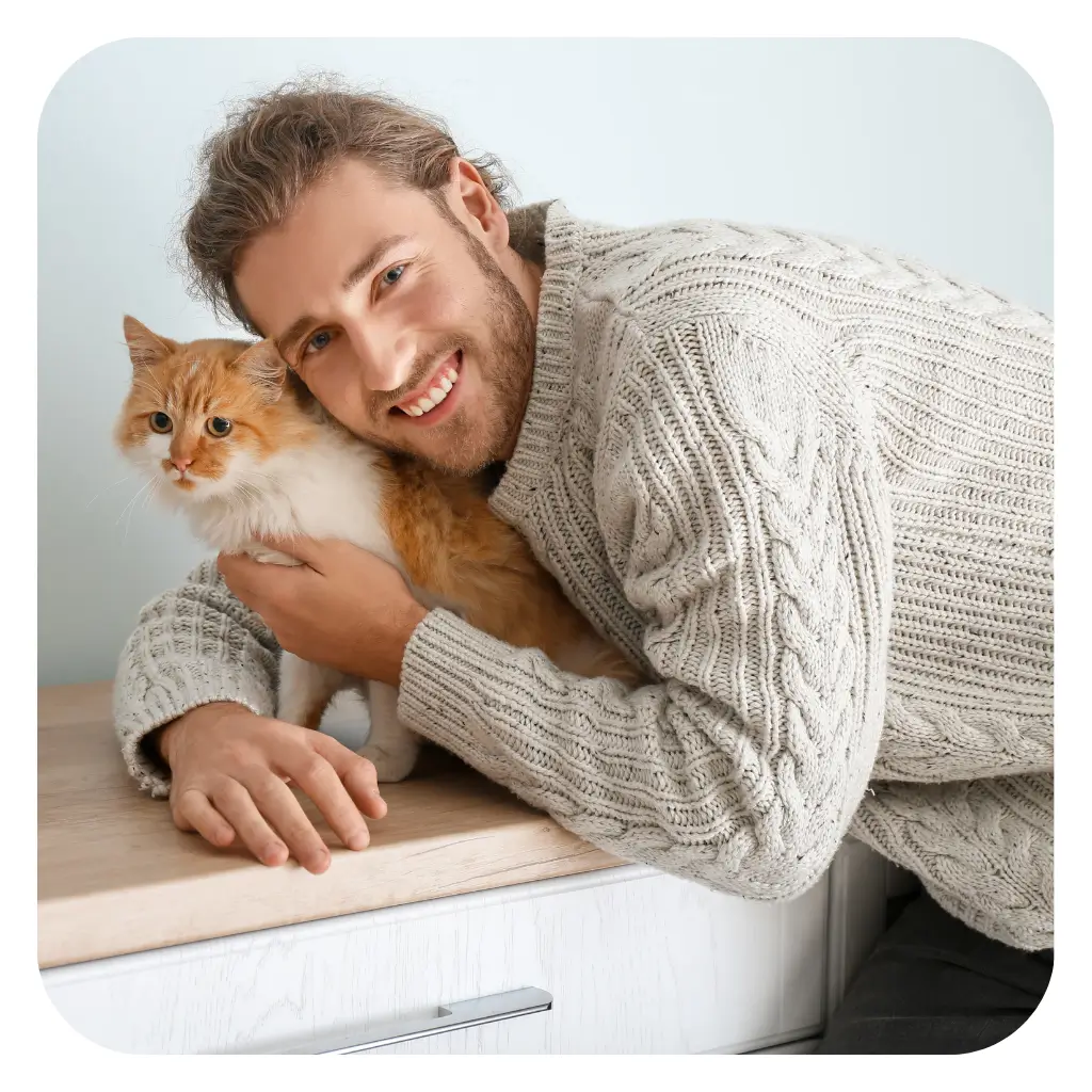 Man with emotional support cat at work after registering with ESA Registry UK