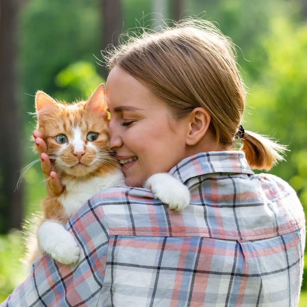 A woman petting her emotional support cat after registering with ESA Registry UK