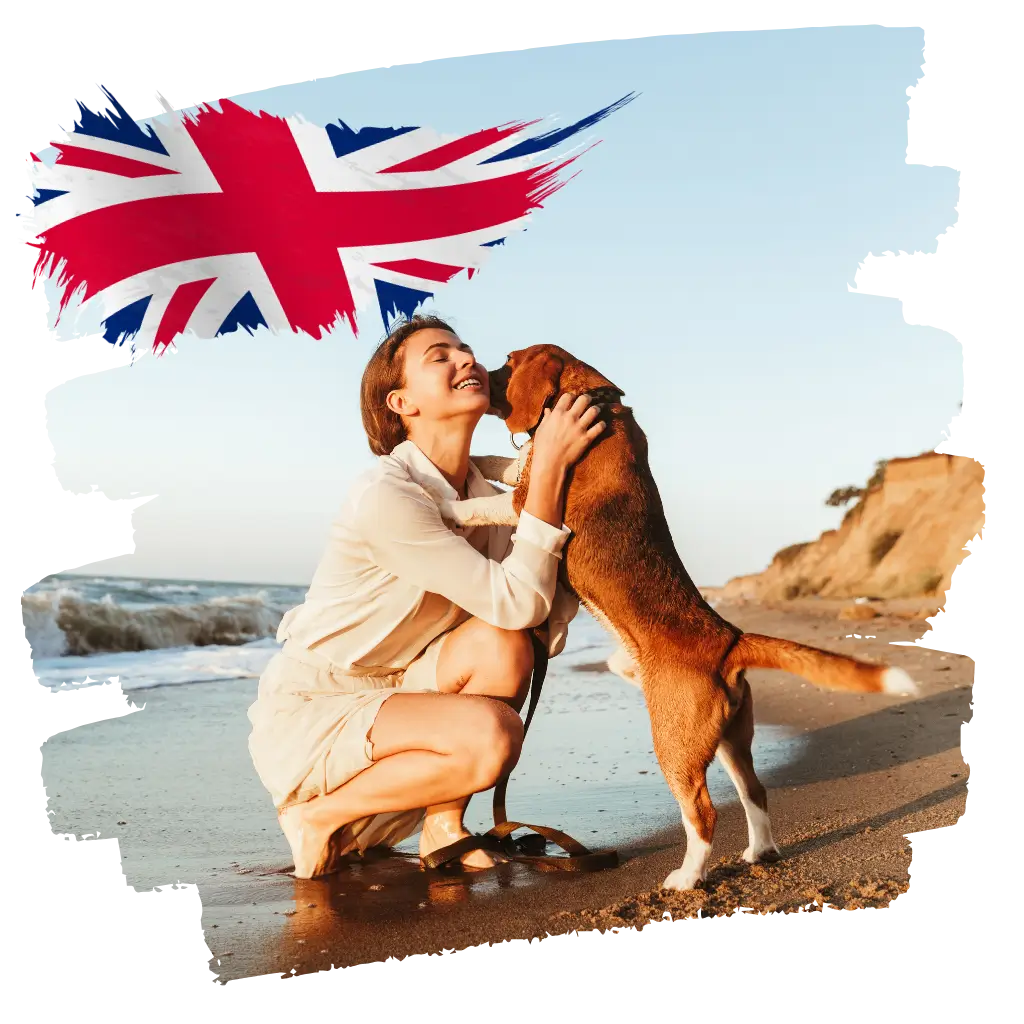 A lady on the beach petting her emotional support animal in the UK. after registering their emotional support animal with ESA registry UK